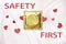 Safety first. Golden condom package on background, top view