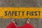 Safety First Sign on caution strip.