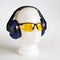 Safety headphones protection of hearing from noise, protective glasses, head of mannequin close-up