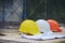 Safety helmet hard hat, blueprint, face mask, and drawing paper for engineer, safety officer or architect, place on wooden floor