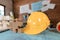 Safety helmets  and jigsaw on design plan on the table at site construction