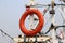 Safety life ring hanging on fishing boat masts