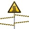 Safety sign. Beware of danger Hot surface. Barrier tape and sign on a pole with a striped ribbon. Yellow-black ribbon on