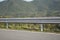 Safety steel barrier on freeway bridge designed to prevent the exit of the vehicle from the curb or bridge.