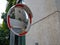 Safety traffic panoramic street mirrorby a building