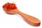 Safflower in a wooden spoon