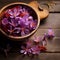 Saffron flowers in wooden bowl on a wooden background