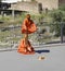 Saffron Robe clad street performers