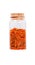 Saffron stamens in a glass bottle with cork stopper, isolated on
