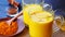 Saffron turmeric golden milk in two glass mugs