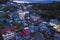 Sagada, Mountain Province, Philippines - Aerial of the hillside town as twilight sets in, highlighting the glowing