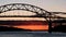 Sagamore Bridge at Sunrise with a boat