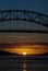 Sagamore bridge at sunrise with the sun
