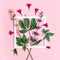 Sage branch and Weigela flowers with white paper frame on pink background