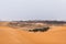 Sahara desert landscape with sand dunes and oasis. Travel in Morocco, Merzouga