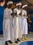 Sahara Desert, Morocco - August 2019: Three Gnawa musicians playing krakebs in Khamlia village in Sahara Desert, Morocco