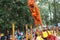 Saigon, Vietnam - 03 Feb 2014: Lion dancing on flower pillars Mai Hoa Thung at Tao Dan Park at the Lunar New Year