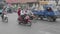 Saigon, Vietnam - 3 Feb. 2018: heavy rush hour traffic, motorbike riders on the busy roads in downtown Saigon HCMC