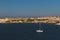 Sail boat traveling on blue water near Valletta, Malta