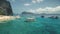 Sail boats on serene seascape at green mountainous isle of Palawan, Philippines. Nobody nature