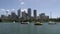 Sail boats and small water taxi in front of Sydney skyline