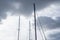 Sail mast in front of a cloudy background