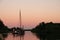 Sail ship at evening sunset on waters of Eernewoude in Friesland