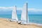 Sail yachts on the beach on Ionian Sea at luxury hotel