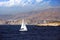 Sailboat across the coast of Benidorm city in Spain.