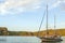 Sailboat at anchorage in beautiful bay at sunset