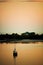 Sailboat anchored in New Pass, Florida in tranquil water.