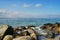 Sailboat in Baltic Sea at a distance seen from the rocks by Travemuende beach