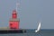Sailboat and Big Red lighthouse