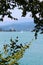 Sailboat, blue lake and mountain