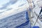 Sailboat bow with the tightened sail, sailing in the wind, with the sea in the background. Concept of water tourism. Sailing a