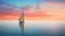 Sailboat on calm sea during vibrant sunset