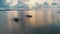 Sailboat on calm water of ocean at colorful sunset aerial closeup. Purple evening sun down. Seascape