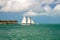 Sailboat on clear blue water of tropical paradise, sailing on holiday island of Sunset Key resort