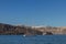 sailboat with cliff behind in the sea of santorini.