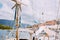 Sailboat detailed parts. Close up of masts of yacht over blue sea. Yachting concept. Soft focus