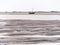 Sailboat dried out on sandflats of tidal sea Waddensea near Boschplaat, Terschelling, Netherlands