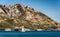 Sailboat floating on the Adriatic Sea in Montenegro. Saint Setafan Island in the background