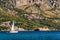 Sailboat floating on the Adriatic Sea in Montenegro. Saint Setafan Island in the background