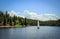 Sailboat floating along the lake