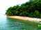 Sailboat floating on a crystal green water of a virgin island. Location: Liquson, mobo masbate, Philippines