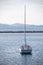 Sailboat floating over a glistening lake