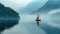 Sailboat Gliding on Serene Foggy Lake