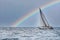 Sailboat heeling with Rainbow