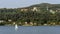 Sailboat on Lake Maggiore with the Colossus of San Carlo Borromeo in the background, Arona, Italy