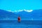 Sailboat on lake Maggiore in the mountains of the Alps